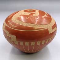 Red seed pot with a sgraffito avanyu, feather and geometric design
 by Lawrence Yepa of Jemez