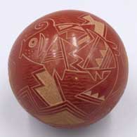 Miniature red seed pot with a sgraffito fish, water wave and geometric designJ55
 by Susan Romero of Santa Clara