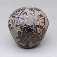 Red-on-black seed pot with a sgraffito and painted butterfly, hummingbird, flower, and geometric design
 by Gwen Tafoya of Santa Clara