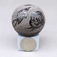 Miniature black seed pot with a sgraffito butterfly, flower, and geometric design
 by James Moquino Sr of Santa Clara