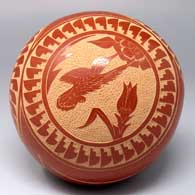 Red seed pot with a 3-medallion sgraffito flower, bird, butterfly, feather and geometric design
 by Vangie Tafoya of Jemez