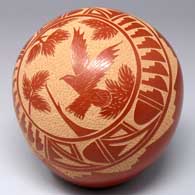 Red seed pot with a sgraffito bird, pine branch and geometric design
 by Brenda Tafoya of Jemez