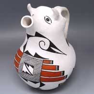 Polychrome cow pitcher with dragonfly, bird element and geometric design
 by Unknown of Acoma
