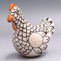 Polychromechickenfigurewithabirdelementandgeometricdesign, click or tap to see a larger version