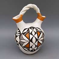 Polychrome wedding vase with braided handle and geometric design
 by Eva Histia of Acoma