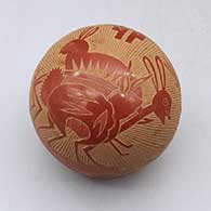 Miniature red seed pot with sgraffito rabbit, butterfly, and geometric design
 by Joseph Lonewolf of Santa Clara