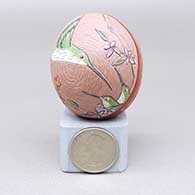Miniature polychrome seed pot with a sgraffito and intricately painted hummingbird and chick, butterfly, nest, flower, branch, leaf, fine line, and geometric design
 by Unknown of Santa Clara