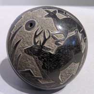 Black seed pot with sgraffito deer and geometric design 
 by Ray Tafoya of Santa Clara