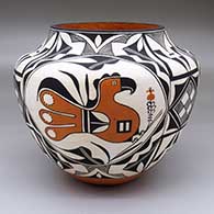 A polychrome jar decorated with a three-panel parrot and Mimbres geometric design
 by Florence Aragon of Acoma