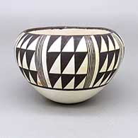 Black-on-white bowl with an eight panel geometric design
 by Anita Lowden of Acoma