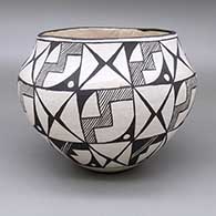 Black-on-white jar with a fine line and geometric design
 by Unknown of Acoma