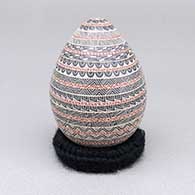 Polychrome egg-shaped seed pot with a sgraffito and painted geometric design
 by Laura Bugarini of Mata Ortiz and Casas Grandes