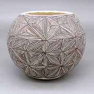 Black-on-white jar with a fine line geometric design
 by Marie Juanico of Acoma