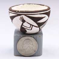 Miniature black-on-white bowl with a 4-panel kokopelli and geometric designC40
 by Lucy Lewis of Acoma