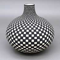 Black-on-white jar with a checkerboard geometric design
 by Paula Estevan of Acoma