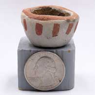 Miniature red-on-buff bowl with a geometric designK05
 by Unknown of Tesuque