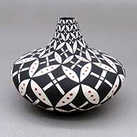 Small polychrome jar with a snow geometric design
 by Dorothy Torivio of Acoma