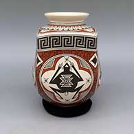 Polychrome jar with distinctive round and square shape and flared lip with Mimbres animal, bird, lizard, frog, and geometric design
 by Luis Martinez of Mata Ortiz and Casas Grandes