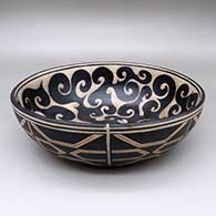 Polychrome bowl with an eight-panel geometric design on outside and an organic design on inside
 by Lisa Holt and Harlan Reano of Cochiti and Santo Domingo
