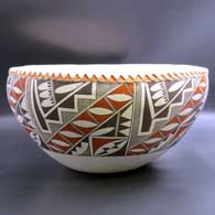 Large polychrome bowl with pie crust rim and 7-panel geometric design
 by Grace Chino of Acoma