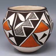 Polychrome jar with a 4-panel geometric design
 by Lucy Lewis of Acoma