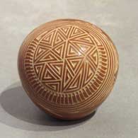 Red seed pot with a sgraffito feather and geometric designL03
 by Glendora Fragua of Jemez