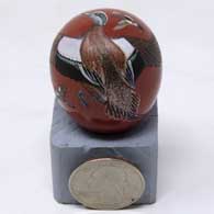 Miniature polychrome seed pot with sgraffito and painted wigeon, butterfly and cross design
 by Joseph Lonewolf of Santa Clara