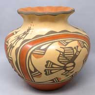 Polychrome jar with roadrunner, rainbow, corn plant and geometric design plus a pie crust rim
 by Ruby Panana of Zia