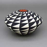 Polychrome seed pot with a geometric design
 by Cletus Victorino of Acoma