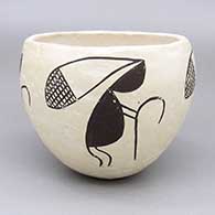 Black and white bowl with a four-panel Mimbres kokopelli design
 by Unknown of Acoma