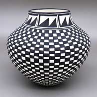 Black and white jar with a checkerboard and geometric design
 by Cletus Victorino of Acoma