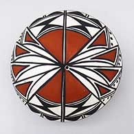 Polychrome seed pot with a geometric design
 by Cletus Victorino of Acoma