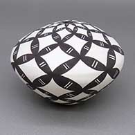 Black and white seed pot with a geometric design
 by Cletus Victorino of Acoma