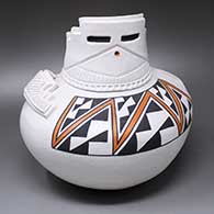 A polychrome jar sculpted like a kiva with cutouts, an applique, corrugation, rock art and a geometric design
 by Jackie Shutiva of Acoma