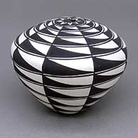 Black-on-white seed pot with a painted geometric design
 by Cletus Victorino of Acoma