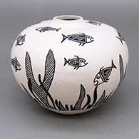 Black-on-white jar with a painted fish and underwater plant design
 by LaDonna Victoriano of Acoma
