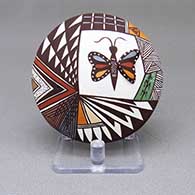 Polychrome seed pot with an applique and painted butterfly, cornstalk, fine line, feather ring, and geometric design
 by Carolyn Concho of Acoma