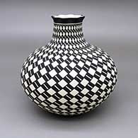 Black-on-white jar with a pie crust opening and a painted checkerboard and geometric design
 by Paula Estevan of Acoma