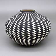 Black-on-white jar with a painted checkerboard geometric design
 by Paula Estevan of Acoma