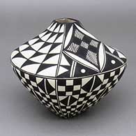 Small black-on-white jar with a square opening and body and a checkerboard, fine line, and geometric design
 by Cletus Victorino of Acoma