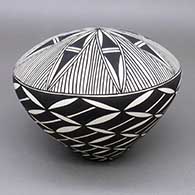 Black-on-white seed pot with a fine line and geometric design
 by Cletus Victorino of Acoma
