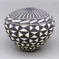 Black-on-white seed pot with a geometric design
 by Cletus Victorino of Acoma