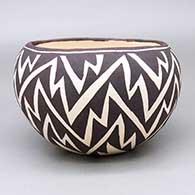 Black-on-white bowl with a lightning bolt geometric design
 by Lucy Lewis of Acoma
