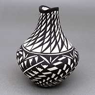Small black-on-white jar with an organic opening and a kiva step, fine line, and geometric design
 by Sandra Victorino of Acoma
