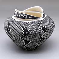 A black-on-white jar with a fine line and geometric design plus a detailed rim feature
 by Shauna Rustin of Acoma