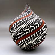 A polychrome tear drop jar with a spiraling geometric design around the body
 by Sandra Victorino of Acoma