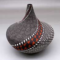 A polychrome tear drop jar decorated with a spiraling fine line, checkerboard and geometric design
 by Sandra Victorino of Acoma