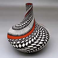 A polychrome high-neck jar decorated with a spiraling geometric design
 by Sandra Victorino of Acoma