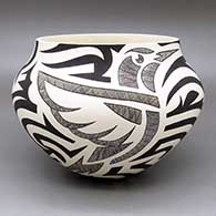 Black-on-white jar with a hummingbird, fine line, and bold geometric design
 by Eric Lewis of Acoma