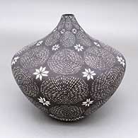 Black-on-white seed pot with a fine line, feather, kiva step, and geometric design
 by Sandra Victorino of Acoma